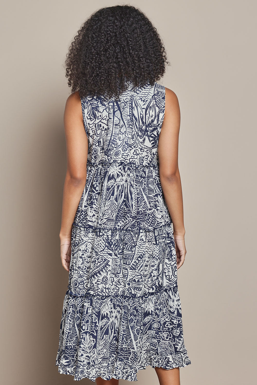 Model Ziara wearing size 10 of the Sleeveless Cotton Boho Dress in colour Navy, from the back