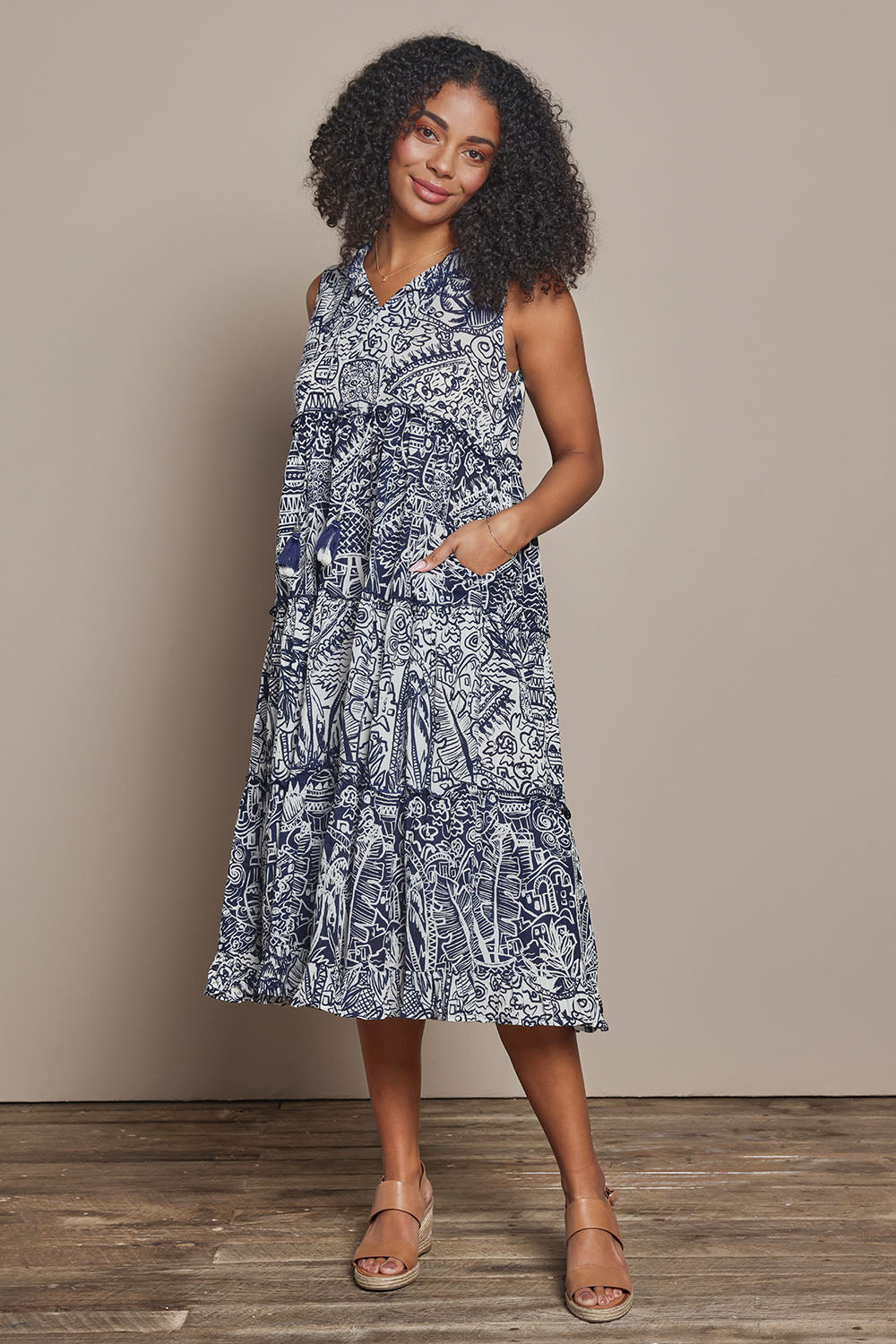 Model Ziara wearing size 10 of the Sleeveless Cotton Boho Dress in colour Navy, from the front, showing the whole outfit