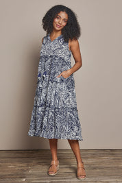 Model Ziara wearing size 10 of the Sleeveless Cotton Boho Dress in colour Navy, from the front, showing the whole outfit