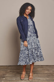 Model Ziara wearing size 10 of the Sleeveless Cotton Boho Dress in colour Navy, from the front, showing the whole outfit