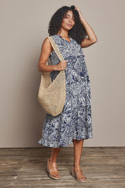 Model Ziara wearing size 10 of the Sleeveless Cotton Boho Dress in colour Navy, from the front, showing the whole outfit