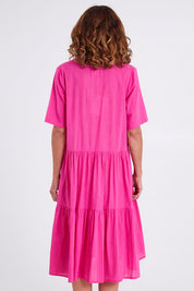 Model Emma wearing size 10 of the Collared Midi Organic Cotton Dress in colour Rose (Pink), from the back