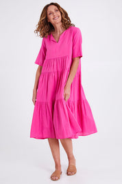 Model Emma wearing size 10 of the Collared Midi Organic Cotton Dress in colour Rose (Pink), from the front, showing the whole outfit