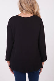 A model wearing the Metal Keyhole 3/4 Slv Top in colour Black (Black), from the back