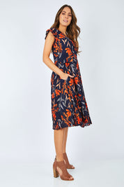 Model Madeline wearing size S of the Layer Dress in colour Floral (Blue), from the front, showing the whole outfit