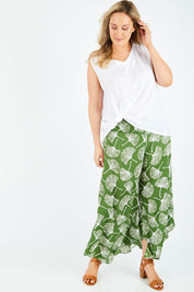 Model Jess wearing size L of the Rayon Flare Pant in colour Greenleaf (Green), from the front, showing the whole outfit