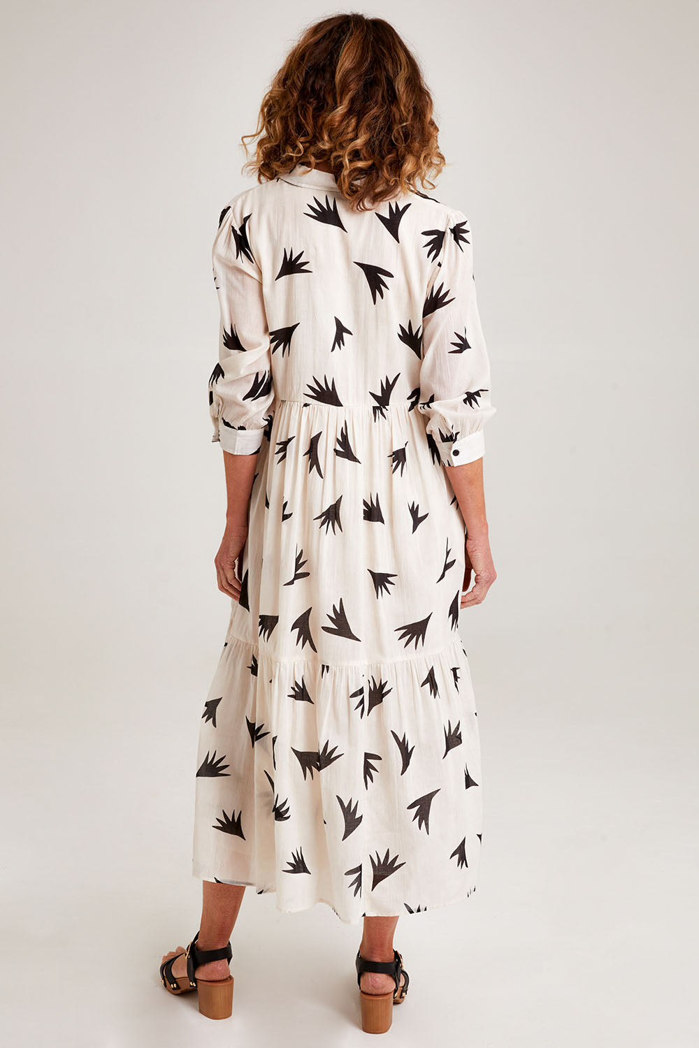 Model Emma wearing size S of the Button Shirt Dress in colour Elegance (White), from the back