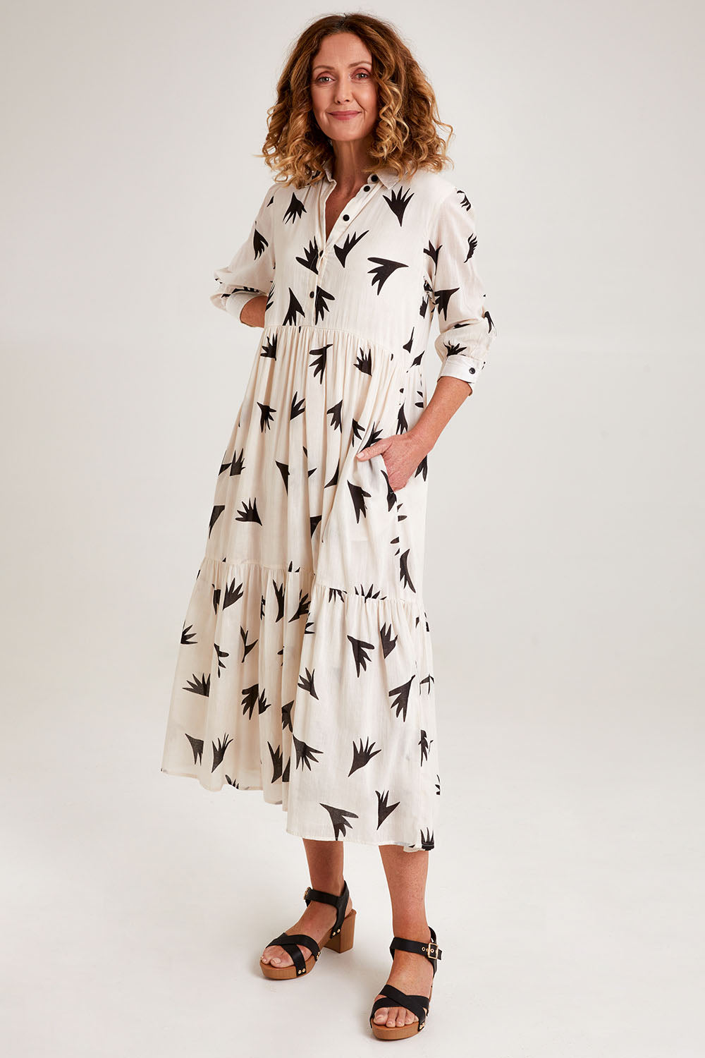 Model Emma wearing size S of the Button Shirt Dress in colour Elegance (White), from the front, showing the whole outfit