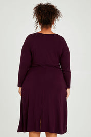 Model Alexis wearing size XXL of the Eden Bamboo Dress in colour Berry (Purple), from the back