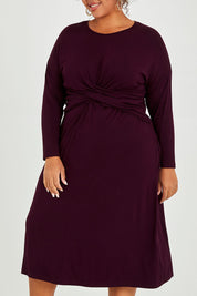 Model Alexis wearing size XXL of the Eden Bamboo Dress in colour Berry (Purple), from the front, cropped image