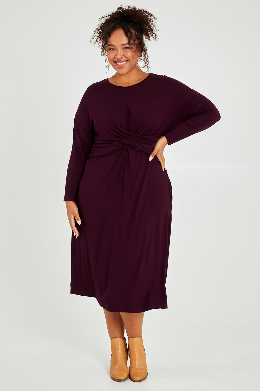 Model Alexis wearing size XXL of the Eden Bamboo Dress in colour Berry (Purple), from the front, showing the whole outfit