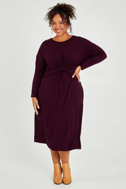 Model Alexis wearing size XXL of the Eden Bamboo Dress in colour Berry (Purple), from the front, showing the whole outfit