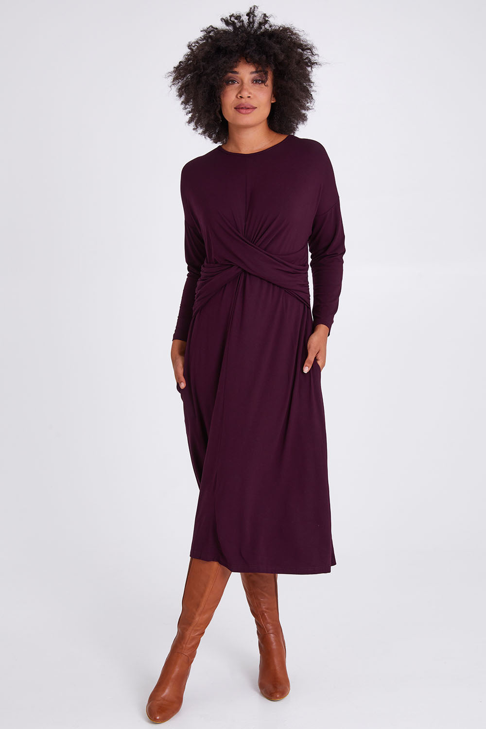 Model Olivia wearing size S of the Eden Bamboo Dress in colour Berry (Purple), from the front, showing the whole outfit