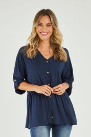 Model Alice wearing size OneSize of the Long Sleeve Bamboo Dazzle Top in colour Navy (Blue), from the front, cropped image