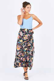 Model Madeline wearing size OneSize of the Ole Skirt in colour Castro (Black), from the front, showing the whole outfit
