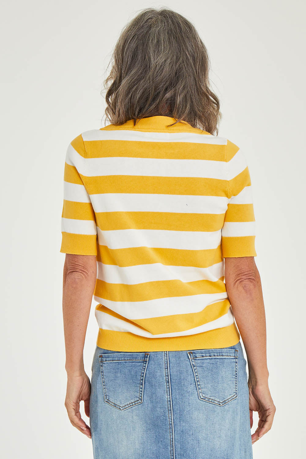 Model Luisa wearing size 10 of the Meadow Sweet Jumper in colour Yellow, from the back
