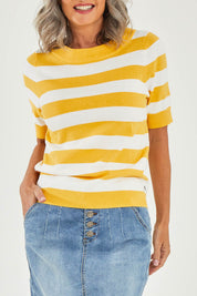 Model Luisa wearing size 10 of the Meadow Sweet Jumper in colour Yellow, from the front, cropped image
