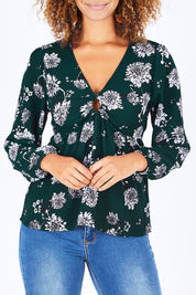 Model Summer wearing size 10 of the Magnolia Fields Keyhole Blouse in colour Magnolia (Green), from the front, cropped image