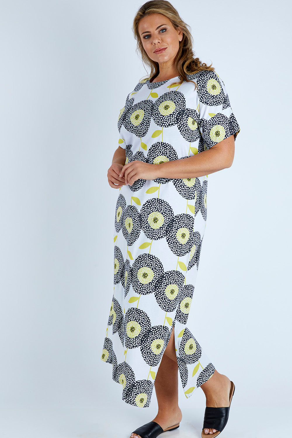 Model Fiona wearing size 16 of the Helg Tee Dress in colour Dotflwr, from the front, showing the whole outfit