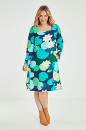 Model Jess wearing size 14 of the Foralskad Dress in colour Lilyblue (Blue), from the front, showing the whole outfit