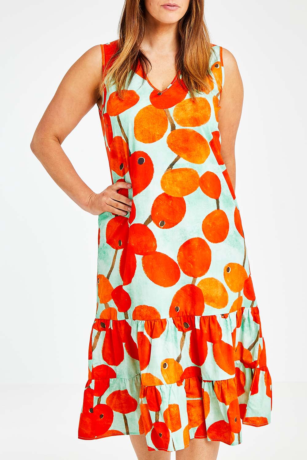 Model Laura wearing size 14 of the Svangande Dress in colour Redberry (Red), from the front, cropped image
