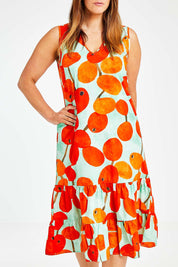Model Laura wearing size 14 of the Svangande Dress in colour Redberry (Red), from the front, cropped image