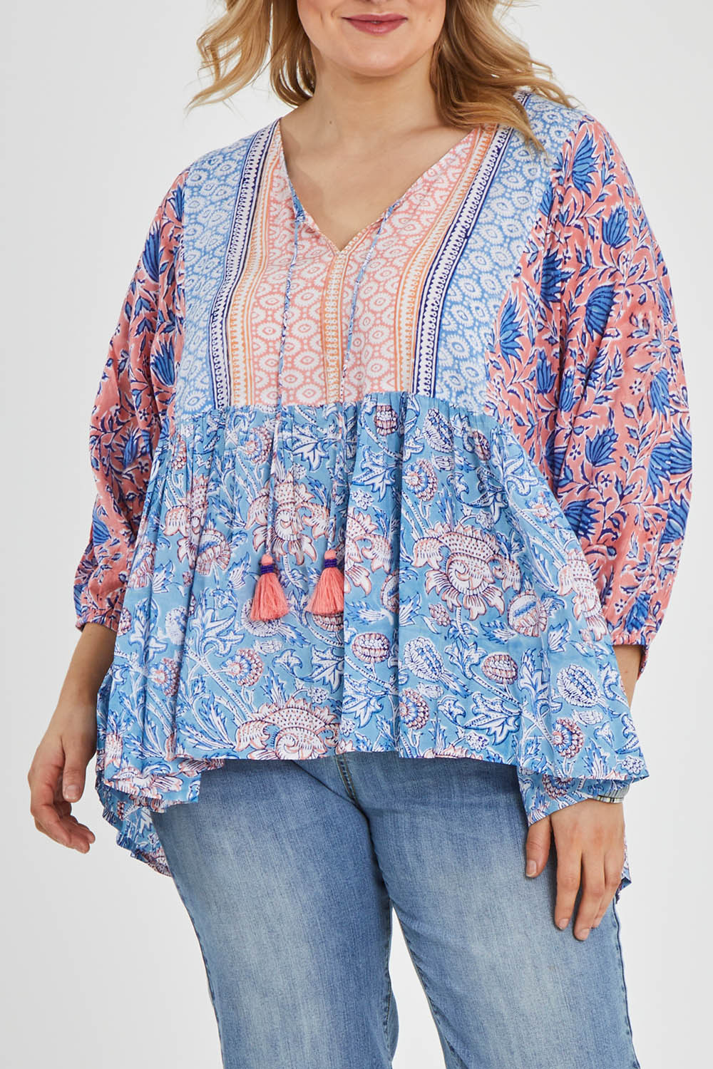 Model Keeara wearing size 16 of the Rosebud Beach Blouse in colour Coralblue (Blue), from the front, cropped image