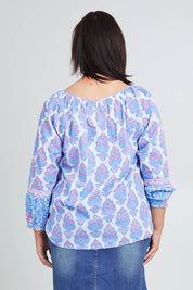 Model Poppy wearing size 16 of the Moonta Bay Cotton Blouse in colour Bluepink (Blue), from the back