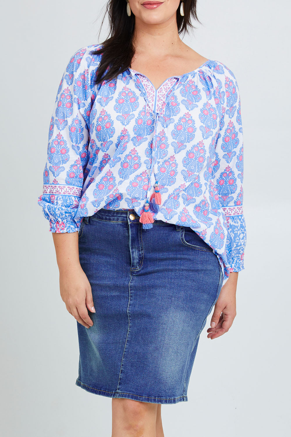 Model Poppy wearing size 16 of the Moonta Bay Cotton Blouse in colour Bluepink (Blue), from the front, cropped image