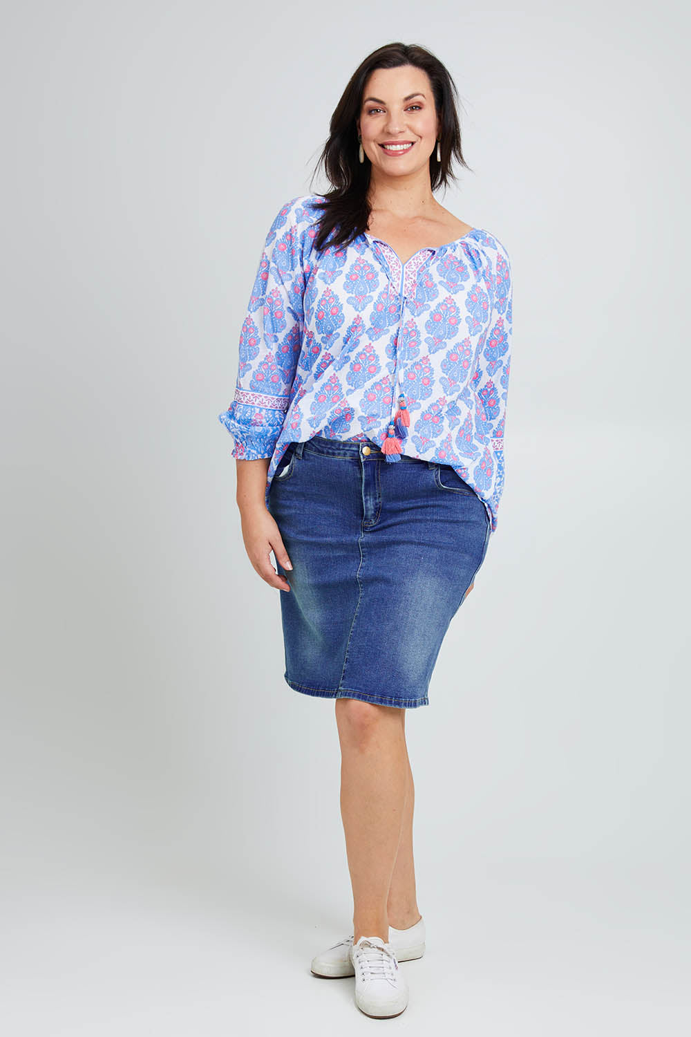 Model Poppy wearing size 16 of the Moonta Bay Cotton Blouse in colour Bluepink (Blue), from the front, showing the whole outfit
