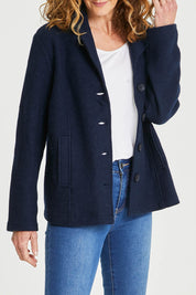 Model Emma wearing size S of the Blazer in colour Navy (Blue), from the front, cropped image