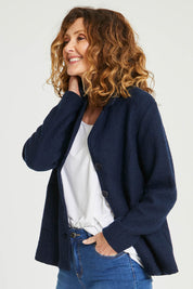 Model Emma wearing size S of the Blazer in colour Navy (Blue), from the front, cropped image