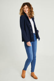 Model Emma wearing size S of the Blazer in colour Navy (Blue), from the front, showing the whole outfit
