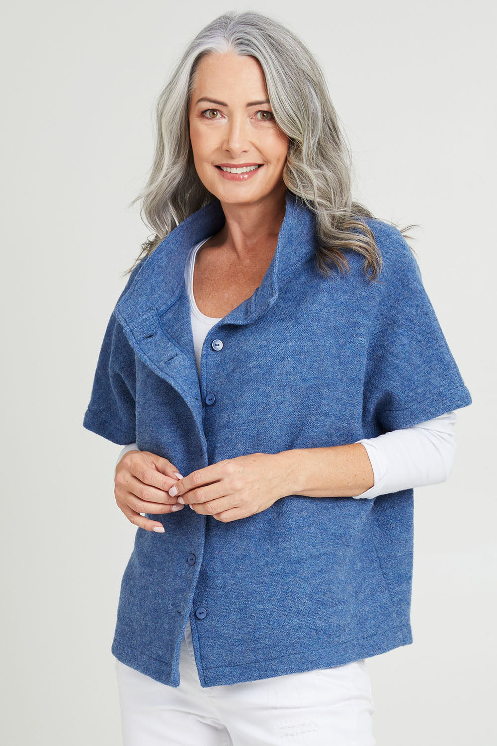 Model Luisa wearing size S of the Button Thru Vest in colour Denim (Blue), from the front, cropped image