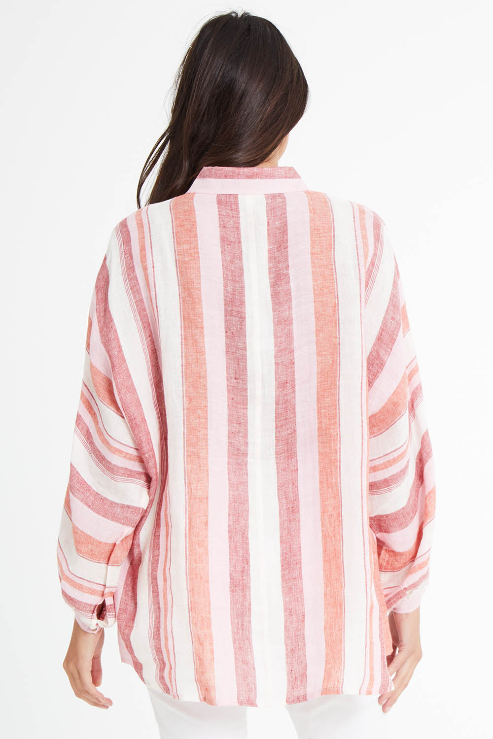 Model Madeline wearing size S of the Milano Shirt in colour Santstrip (Pink), from the back