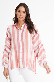 Model Madeline wearing size S of the Milano Shirt in colour Santstrip (Pink), from the front, cropped image