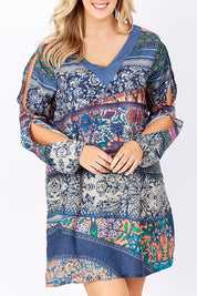 Model Jess wearing the Indica Dress in colour Violet (Purple), from the front, cropped image