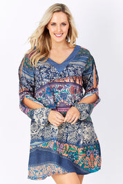 Model Jess wearing the Indica Dress in colour Violet (Purple), from the front, showing the whole outfit