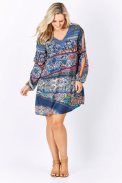 Model Jess wearing the Indica Dress in colour Violet (Purple), from the front, showing the whole outfit