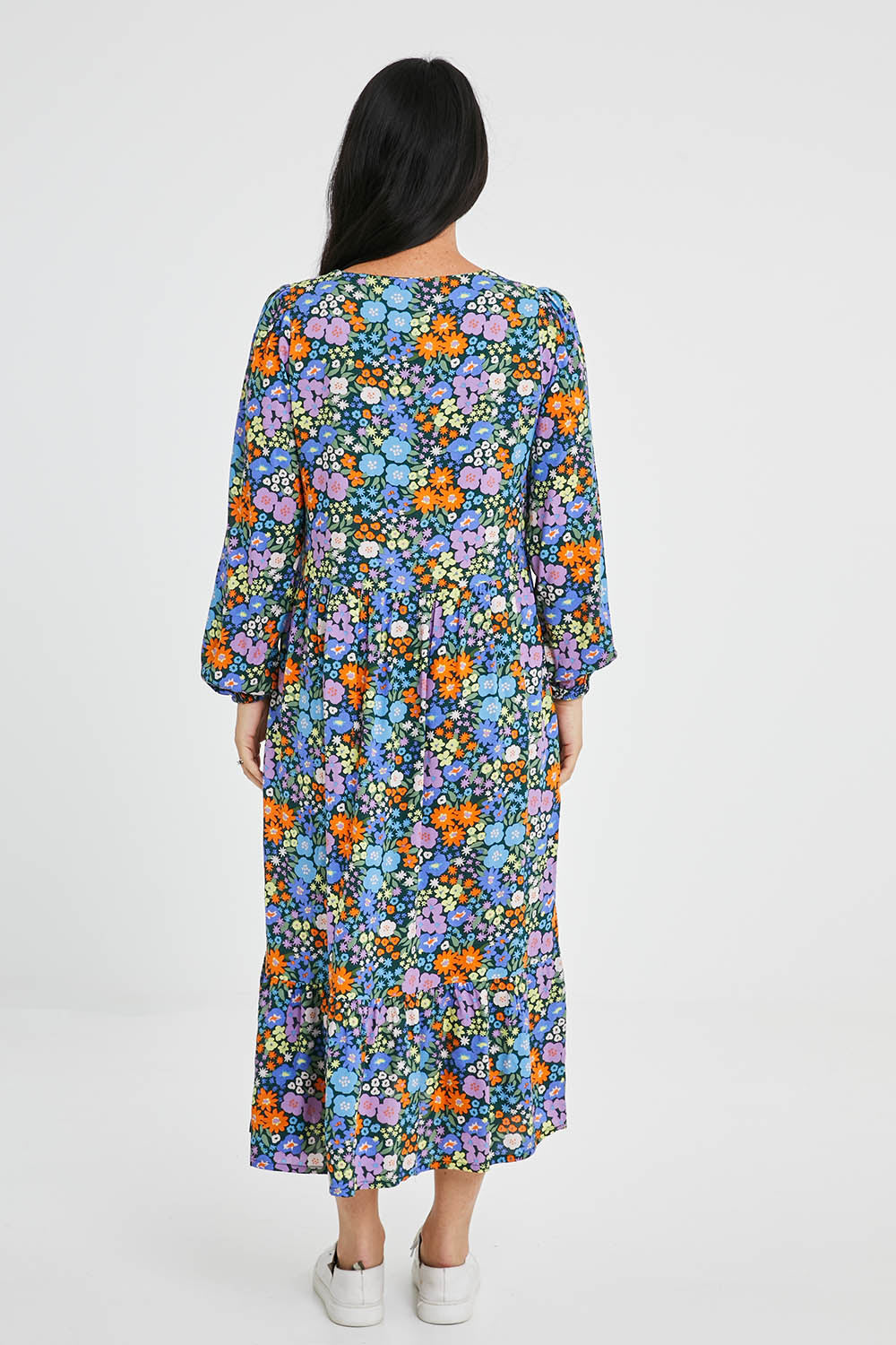 Model Katie wearing size 10 of the Melanie Midi Smock Dress in colour Multi (Black), from the back