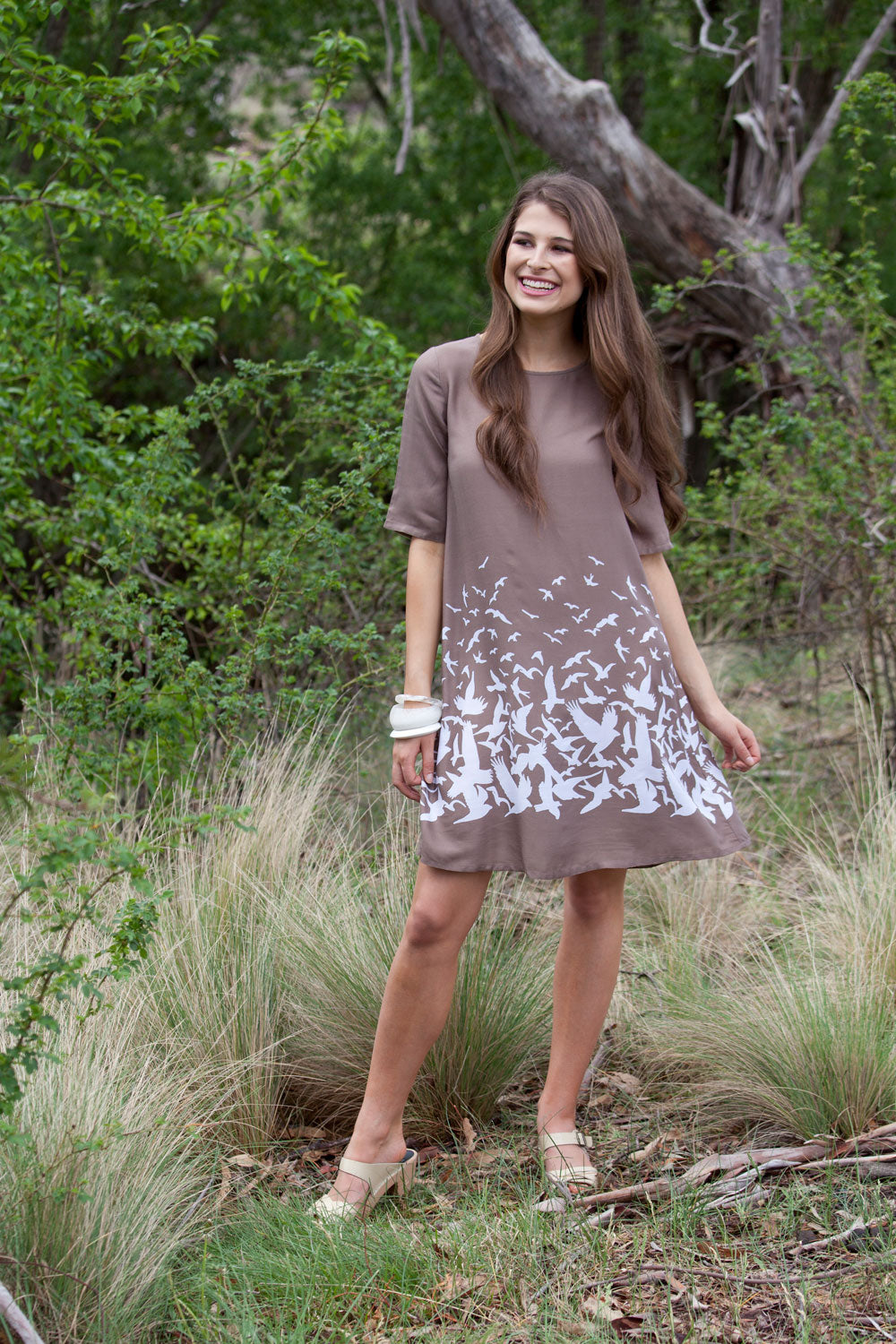 A model wearing size 10 of the ROBBIE 3/4 Sleeve Shift Dress Place M Bird in colour NaturalWht, from the front, showing the whole outfit