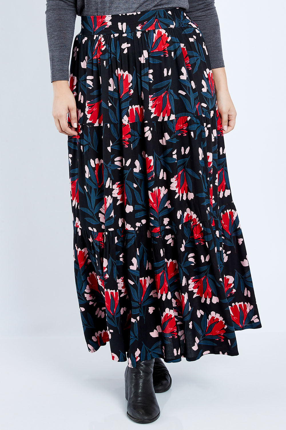 Model Jess wearing size 14 of the Mallory Tier Skirt in colour Paperdaisy (Black), from the front, cropped image