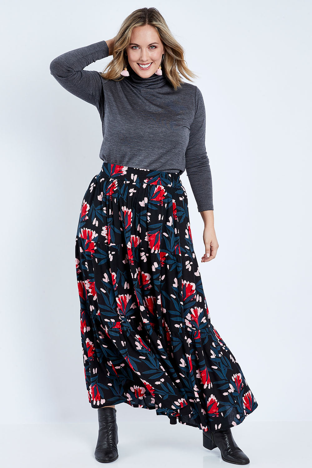 Model Jess wearing size 14 of the Mallory Tier Skirt in colour Paperdaisy (Black), from the front, showing the whole outfit