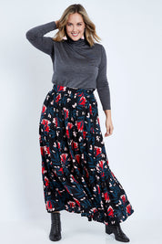 Model Jess wearing size 14 of the Mallory Tier Skirt in colour Paperdaisy (Black), from the front, showing the whole outfit