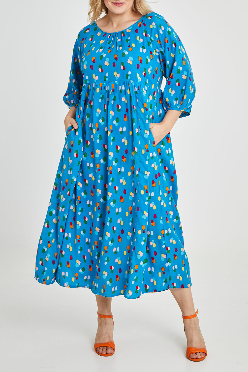 Model Keeara wearing size 16 of the Alice Gathered Dress in colour Speckle (Blue), from the front, cropped image