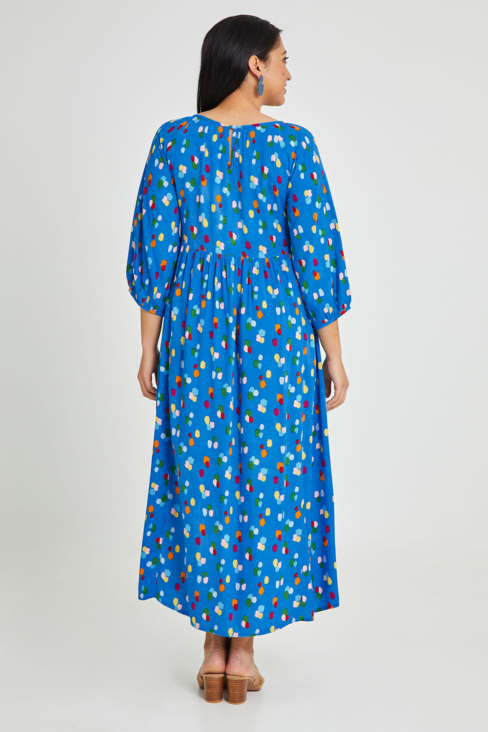 Model Terri-Leigh wearing size 14 of the Alice Gathered Dress in colour Speckle (Blue), from the back
