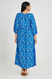 Model Terri-Leigh wearing size 14 of the Alice Gathered Dress in colour Speckle (Blue), from the back