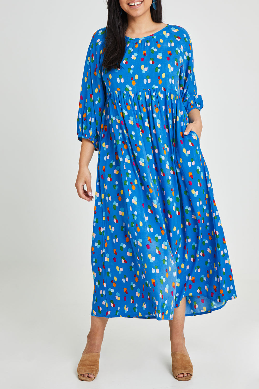 Model Terri-Leigh wearing size 14 of the Alice Gathered Dress in colour Speckle (Blue), from the front, cropped image