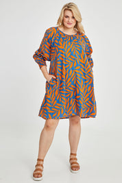 Model Keeara wearing size 16 of the Frankie Shift Dress in colour Leaf, from the front, showing the whole outfit