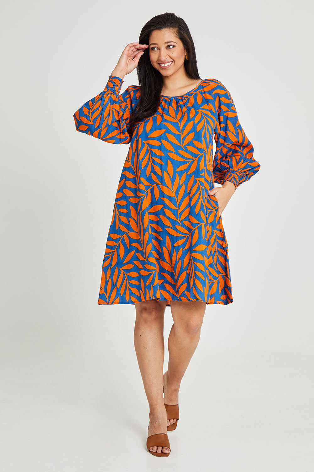 Model Terri-Leigh wearing size 14 of the Frankie Shift Dress in colour Leaf, from the front, showing the whole outfit
